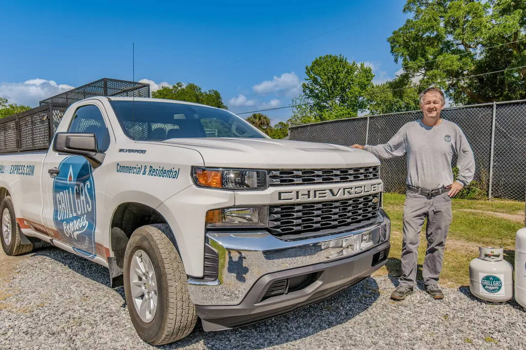 Jason Jordan, founder of Grill Gas Express, beside his propane delivery truck in Pensacola Florida